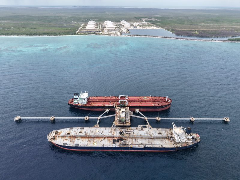Two tankers berthed at the Liwathon B.O.S. Sea Island, with the tank farm on the shore of Grand Bahama behind.