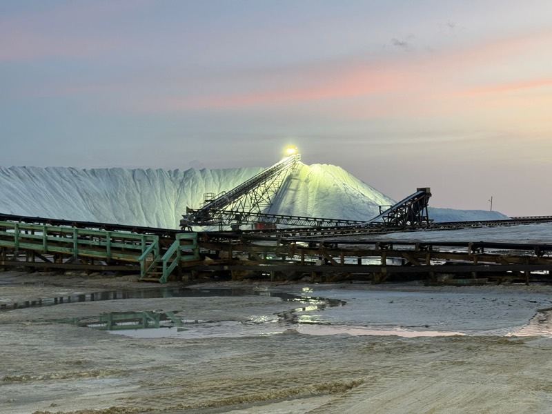 The floodlit salt stockpile and radial stacker at dusk, Great Inagua.